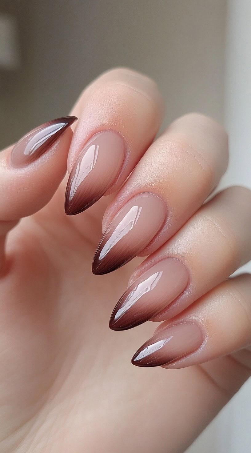 Almond nails with a soft pink base that blends seamlessly into a dark espresso brown tip.