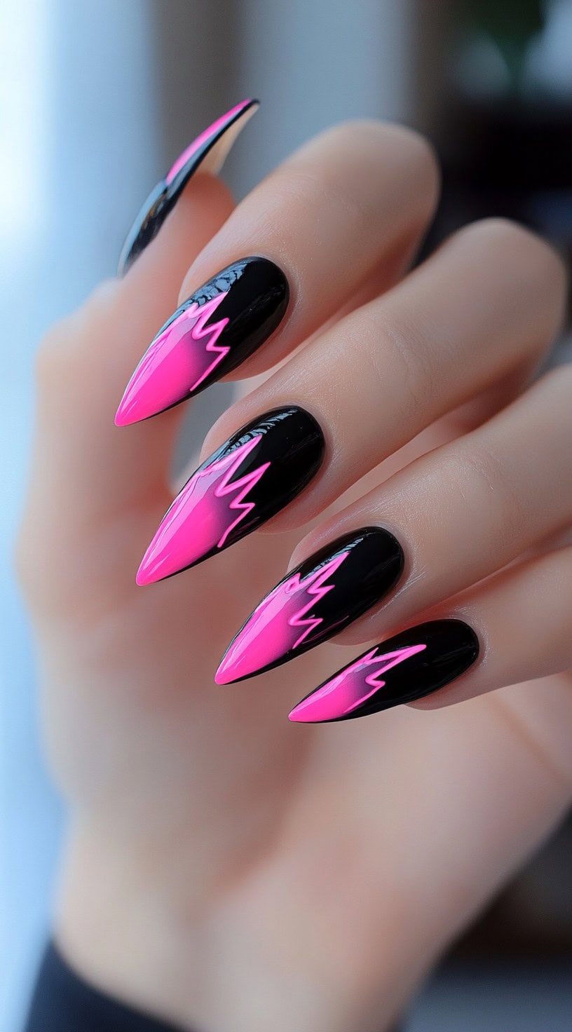 Almond-shaped nails with a black-to-neon pink ombre accented by sharp lightning bolt patterns.