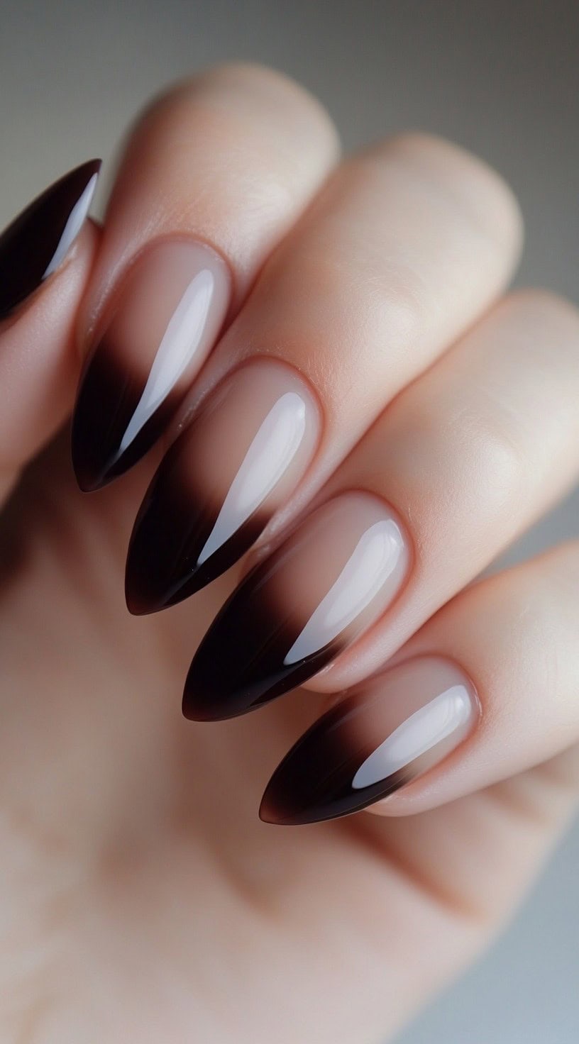 Almond nails with a smoky pink to dark brown ombre and a mirror-gloss finish.