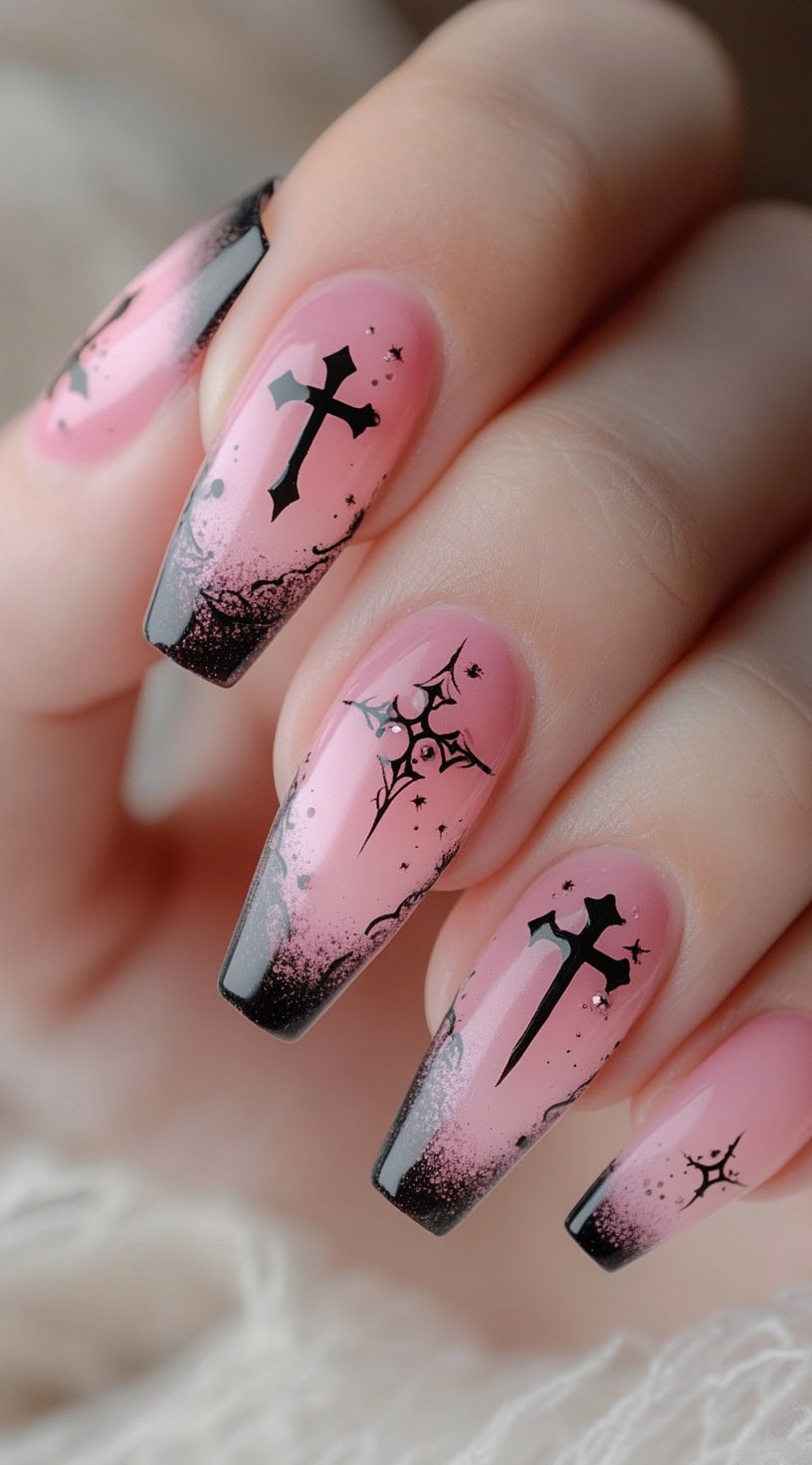 Pink coffin-shaped nails with soft black ombré tips and black gothic cross and sigil designs.