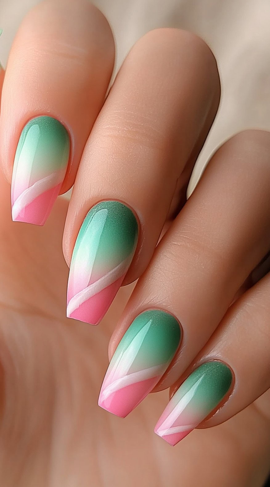 Tapered square-shaped nails with a green to pink ombre base and diagonal white stripe accenting each nail.